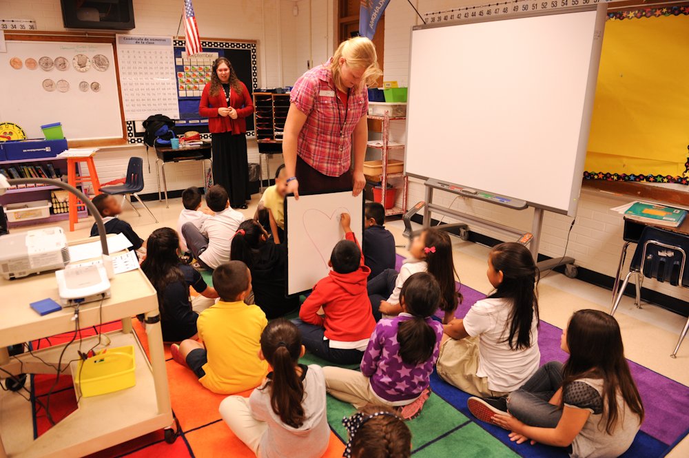 Eliza teaching at school